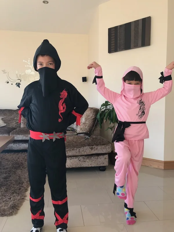 Our kids in ninja costumes, reminding us of the happiness in 18 years of marriage advice